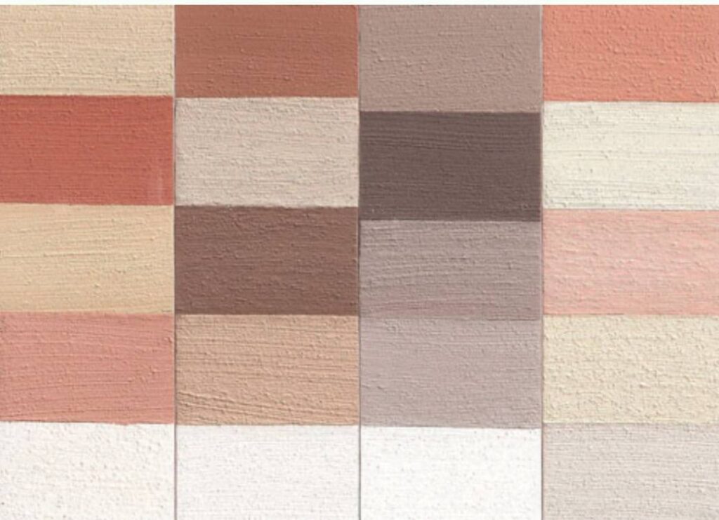 Casa moderna com fachada pintada em tons terrosos, utilizando tintas ecológicas à base de insumos naturais